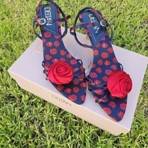 Red and Blue Sandals with Rose Embellishments